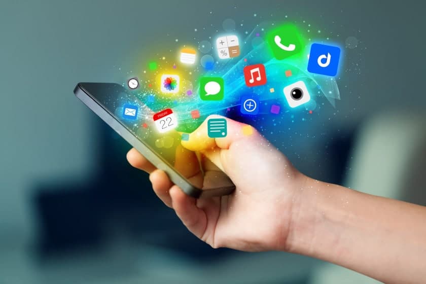 Mobile app development process showing various app icons and smartphone interfaces